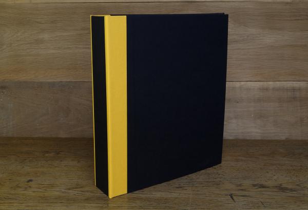 Folder black, yellow linen edges on the back